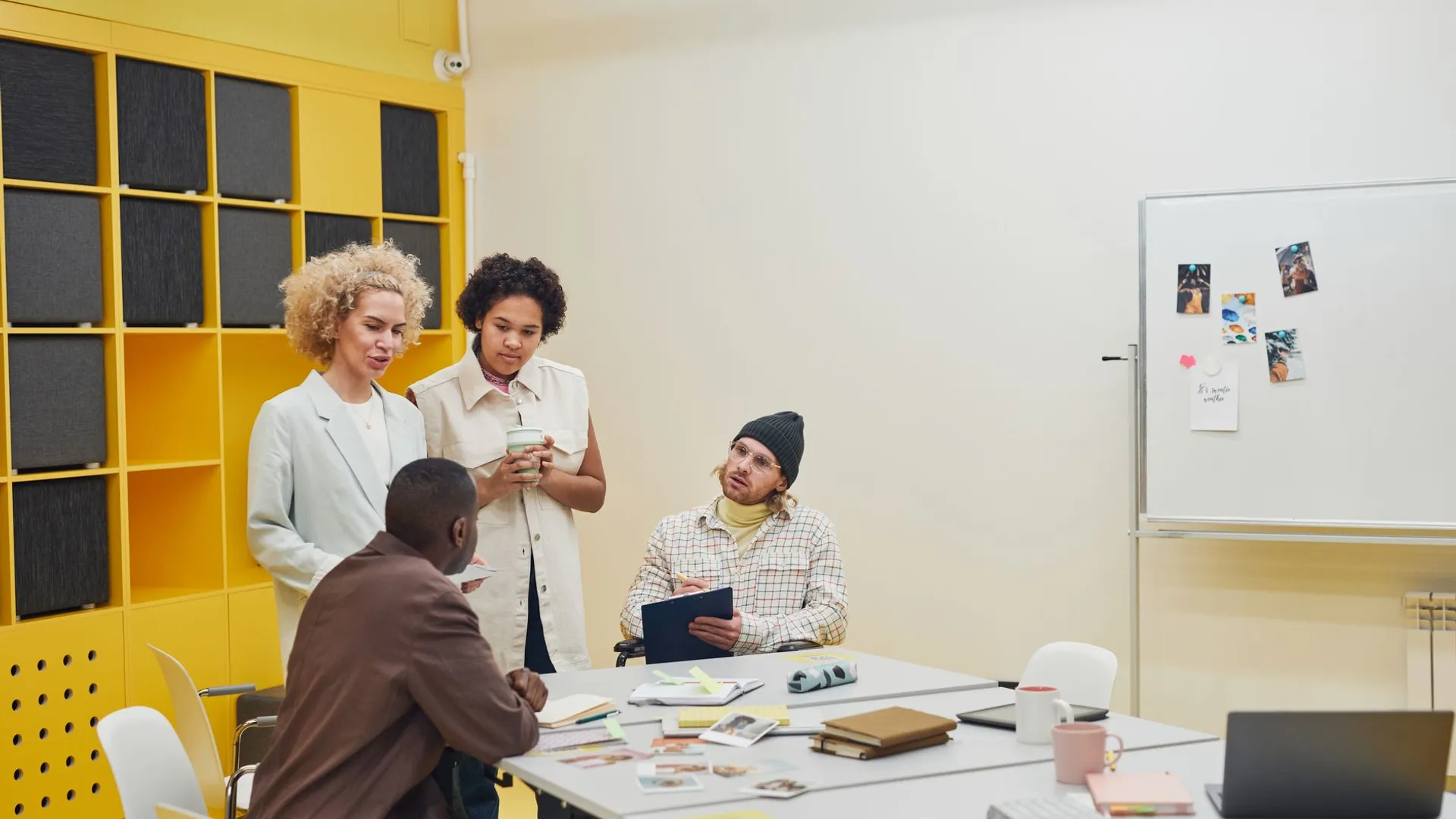 A diverse group of professionals having a collaborative meeting in a modern office space.